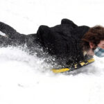 sledding in the snow